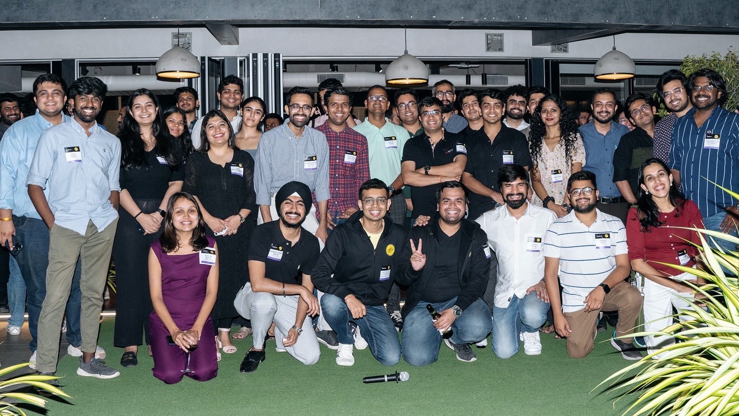 Large group photo of community members at an evening FOC mixer