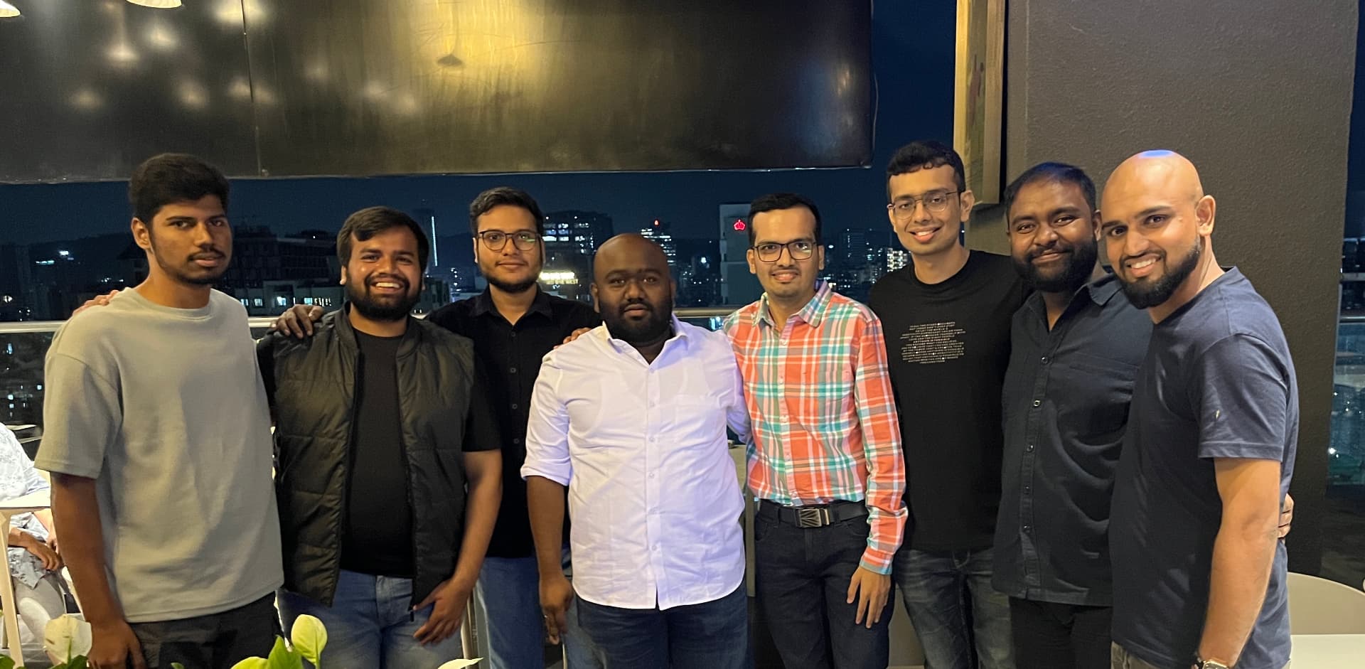 Founders and operators together at a rooftop community evening