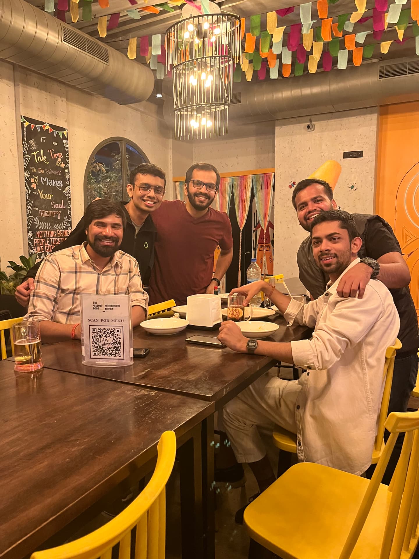 Five operators laughing around a dinner table after an FOC meetup