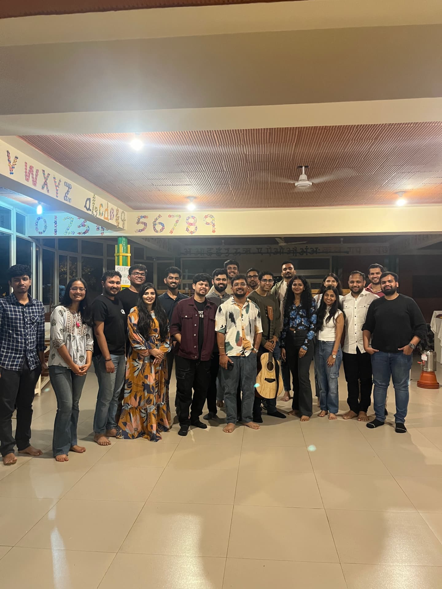 Small FOC offsite group standing together in a hall